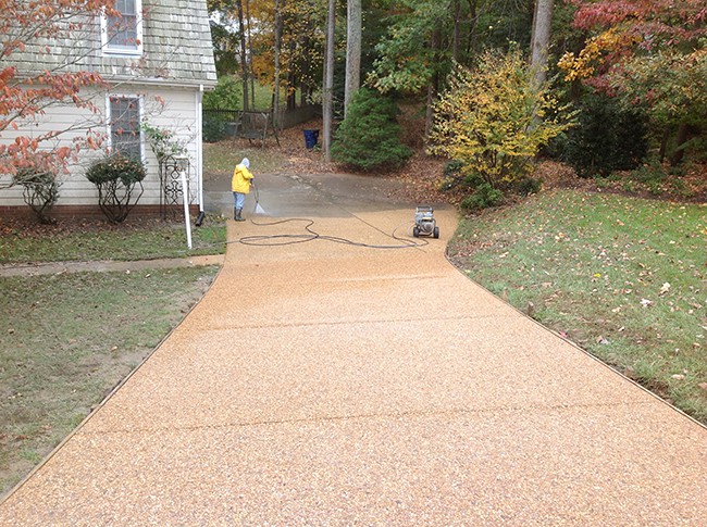 Exp Aggregate driveway half cleaned and sealed